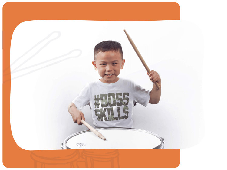 Young boy takes drumming lessons