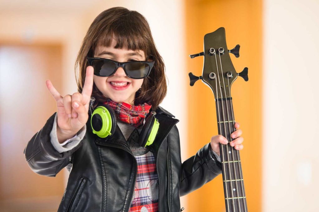 Happy Girl Holding Bass Guitar